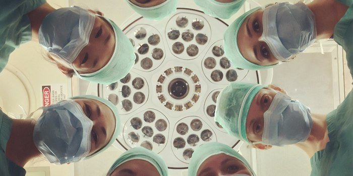 Medical students using virtual reality headsets to practice complex surgical procedures on realistic digital patient models